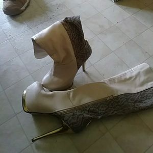 A pair of five and a half knee high boots